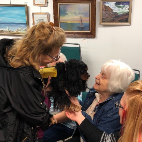 Perdetta visits with certified therapy dog Baci