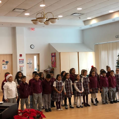 St. Peter's 2nd grade students singing Jingle Bells